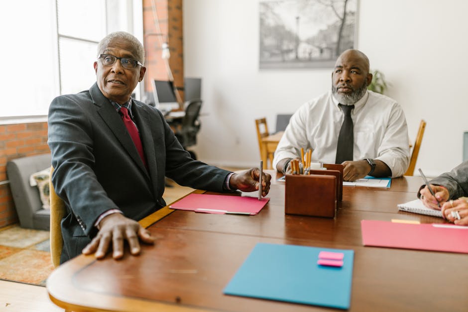 Senior businessmen in a modern office engaged in a collaborative meeting