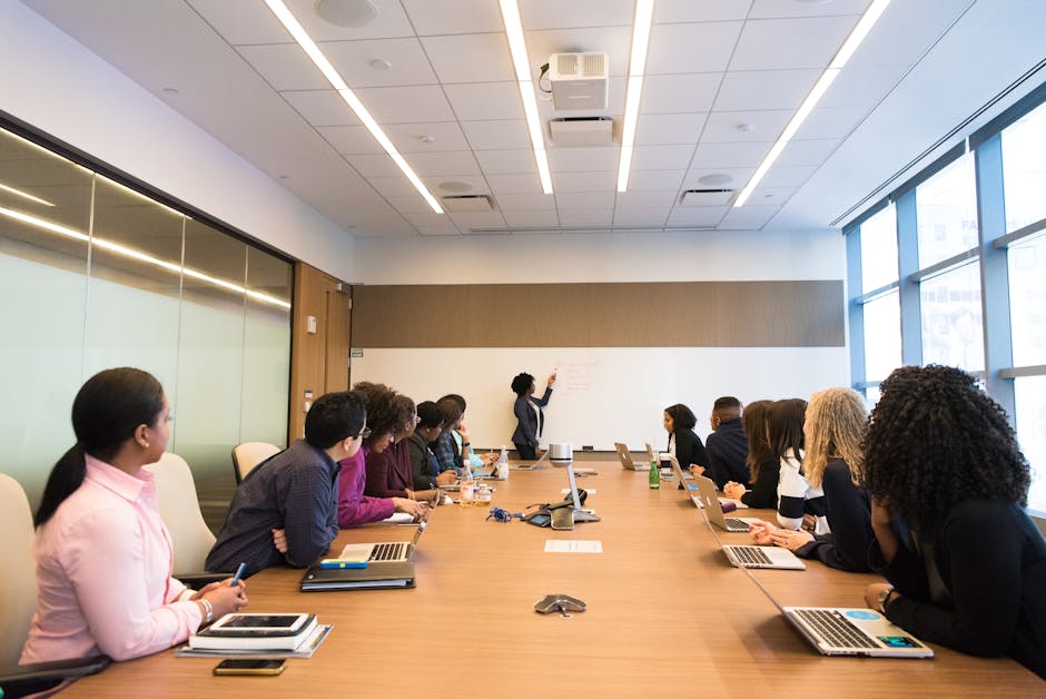 Business meeting with diverse team discussing projects in a modern conference room